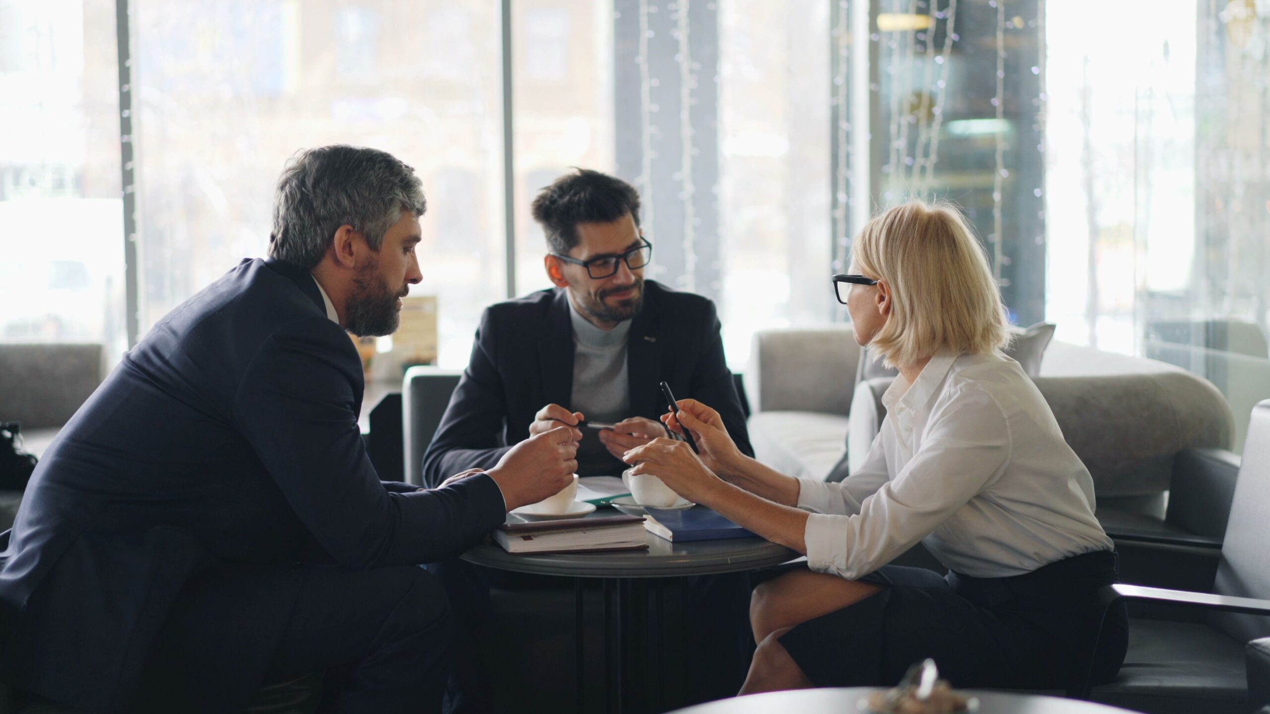 Finance professionals reviewing business documents together